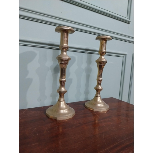 121 - Pair of brass candlesticks in the Victorian style. {28 cm H x 12 cm Dia.}.