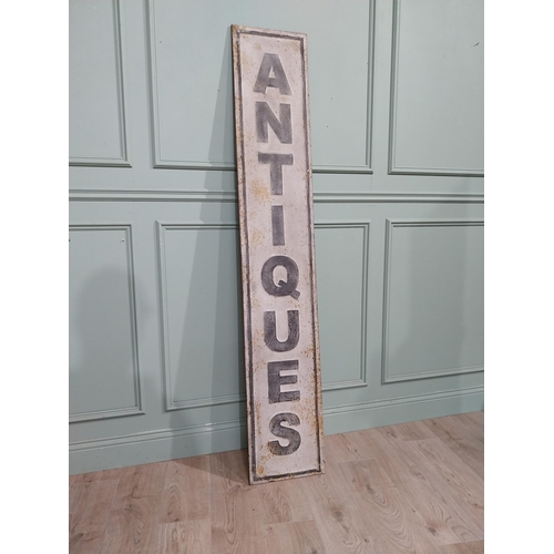 122 - Metal Antiques sign. {191 cm H x 33 cm W}.