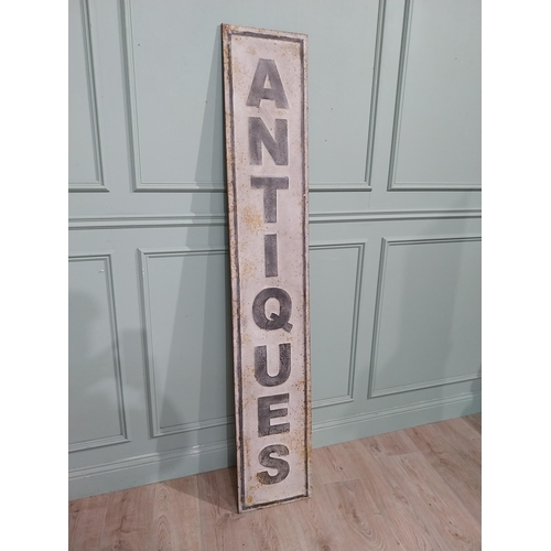 122 - Metal Antiques sign. {191 cm H x 33 cm W}.