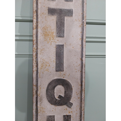 122 - Metal Antique sign. {191 cm H x 33 cm W}.