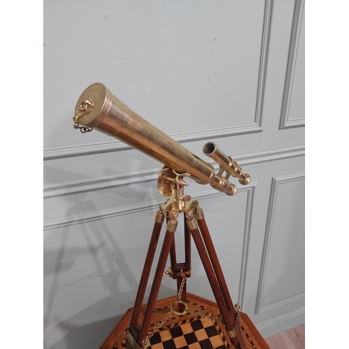 125 - Brass telescope on mahogany tripod stand. {80 cm H x 50 cm W x 36 cm D}.