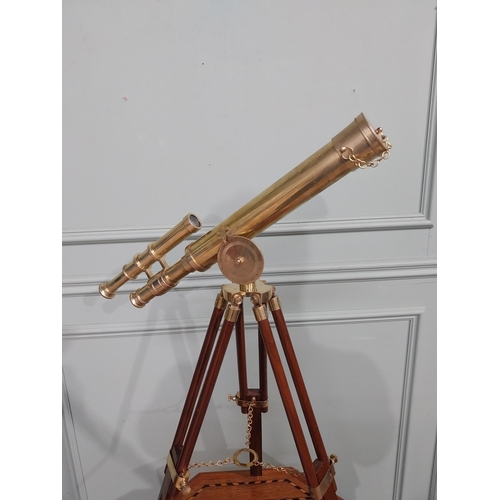 125 - Brass telescope on mahogany tripod stand. {80 cm H x 50 cm W x 36 cm D}.