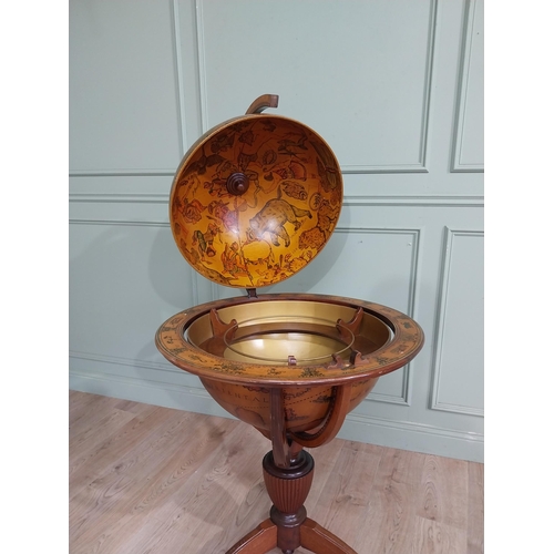 128 - Good quality mahogany world globe drinks cabinet on three outswept feet. {125 cm H x 77 cm Dia.}.