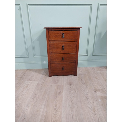 130 - Mahogany four door chest of drawers with decorative handle. {75 cm H x 50 cm W x 35 cm D}.