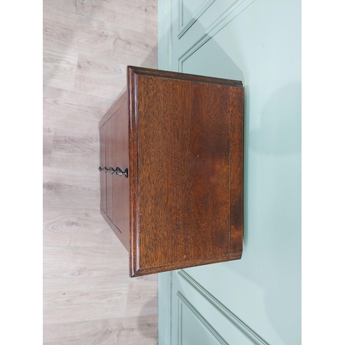 130 - Mahogany four door chest of drawers with decorative handle. {75 cm H x 50 cm W x 35 cm D}.