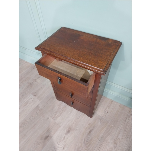 130 - Mahogany four door chest of drawers with decorative handle. {75 cm H x 50 cm W x 35 cm D}.