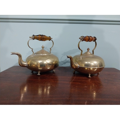 131 - Pair of Edwardian brass kettles. {21 cm H x 26 cm W x 20 cm D}.