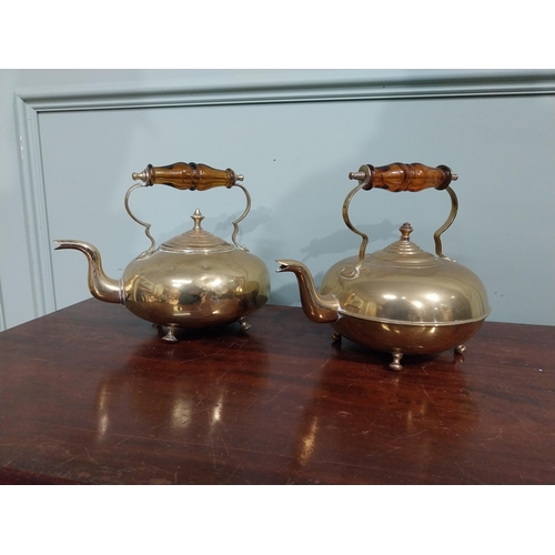 131 - Pair of Edwardian brass kettles. {21 cm H x 26 cm W x 20 cm D}.