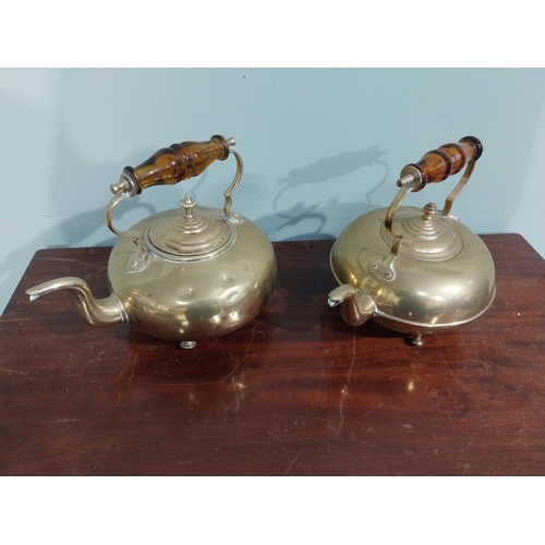 131 - Pair of Edwardian brass kettles. {21 cm H x 26 cm W x 20 cm D}.