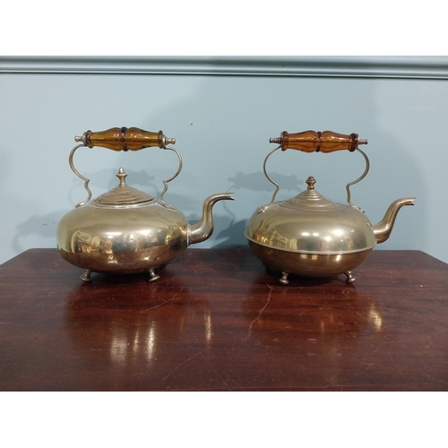 131 - Pair of Edwardian brass kettles. {21 cm H x 26 cm W x 20 cm D}.