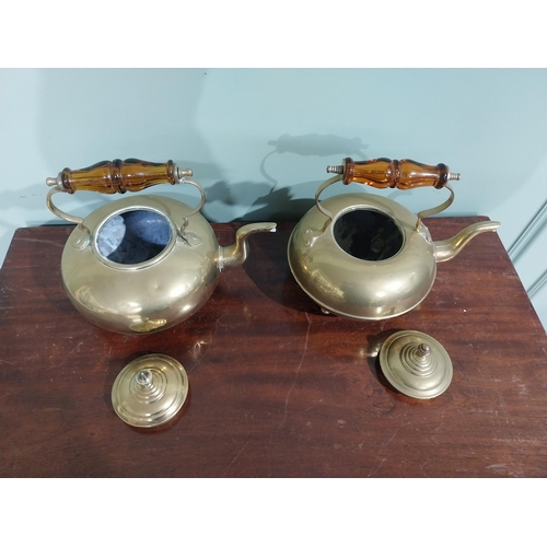 131 - Pair of Edwardian brass kettles. {21 cm H x 26 cm W x 20 cm D}.