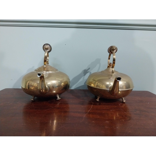 131 - Pair of Edwardian brass kettles. {21 cm H x 26 cm W x 20 cm D}.