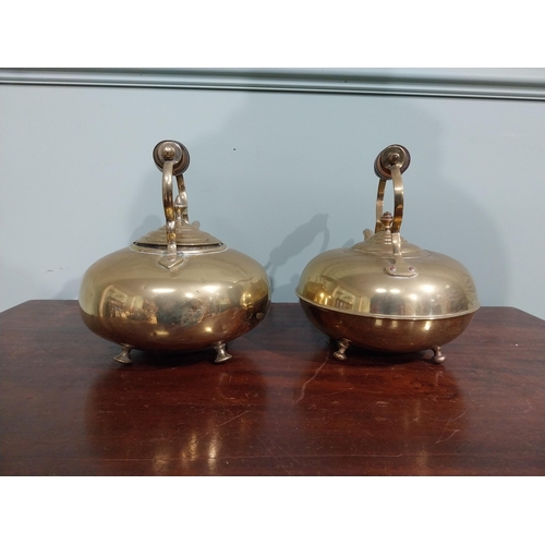 131 - Pair of Edwardian brass kettles. {21 cm H x 26 cm W x 20 cm D}.