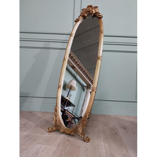 134 - Oval gilt dressing mirror with scroll and leaf decoration in Victorian style {160 cm H x 55 cm W x 5... 