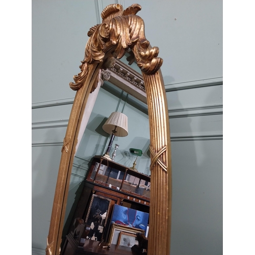 134 - Oval gilt dressing mirror with scroll and leaf decoration in Victorian style {160 cm H x 55 cm W x 5... 