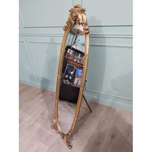 134 - Oval gilt dressing mirror with scroll and leaf decoration in Victorian style {160 cm H x 55 cm W x 5... 