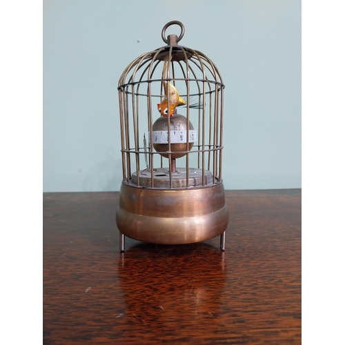 137 - Decorative brass musical bird cage. {17 cm H x 9 cm Dia.}.