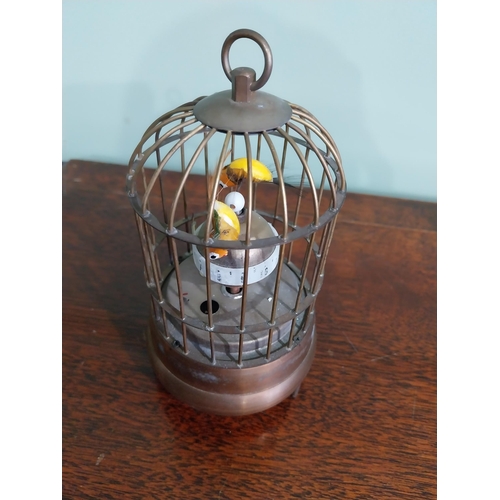 137 - Decorative brass musical bird cage. {17 cm H x 9 cm Dia.}.