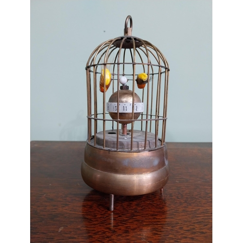 137 - Decorative brass musical bird cage. {17 cm H x 9 cm Dia.}.