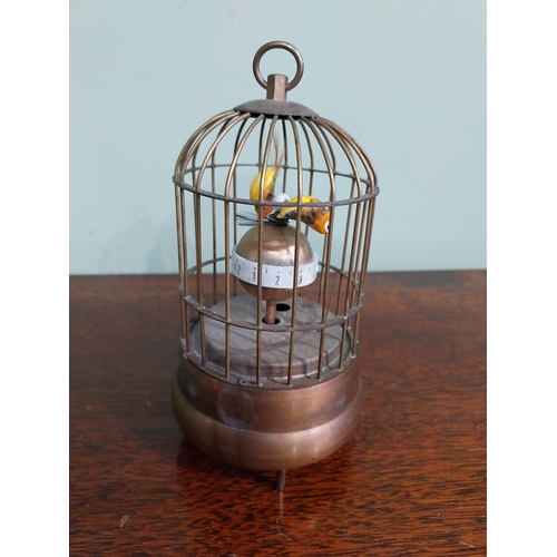 137 - Decorative brass musical bird cage. {17 cm H x 9 cm Dia.}.