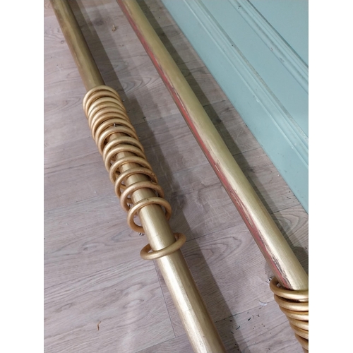 14 - Pair of good quality gilt curtain poles. {240 cm L}.