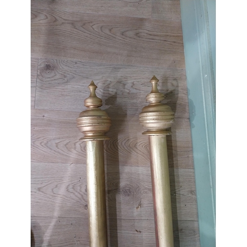 14 - Pair of good quality gilt curtain poles. {240 cm L}.