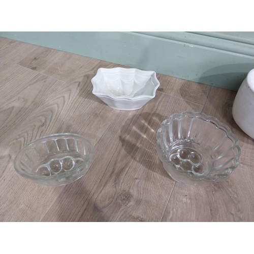 145 - Three early 20th C. Ceramic jelly moulds and three glass moulds. {13 cm H x 20 cm W x 17 to 8 cm H x... 