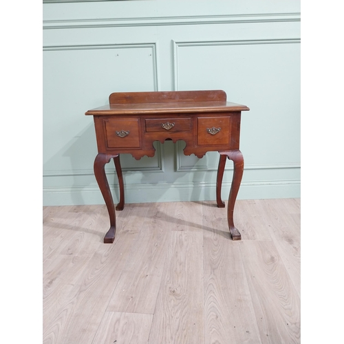 147 - Edwardian walnut lowboy side table with three short drawers in frieze raised on cabriole legs. {79 c... 