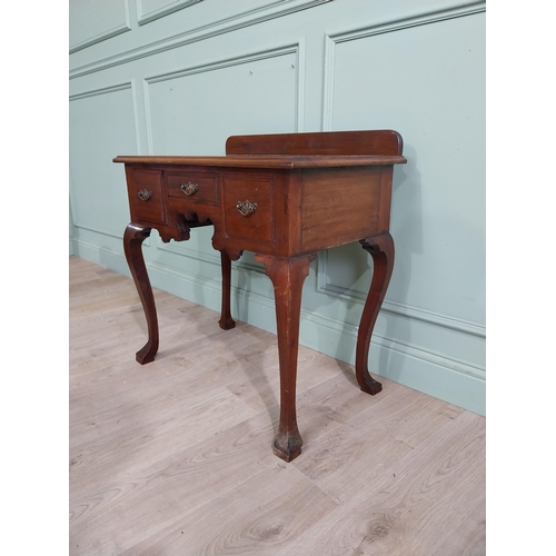 147 - Edwardian walnut lowboy side table with three short drawers in frieze raised on cabriole legs. {79 c... 