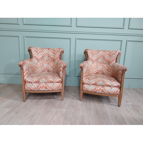 15 - Pair of Edwardian satinwood and upholstered armchairs with stud detail raised on tapered legs. {83 c... 