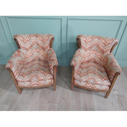 15 - Pair of Edwardian satinwood and upholstered armchairs with stud detail raised on tapered legs. {83 c... 