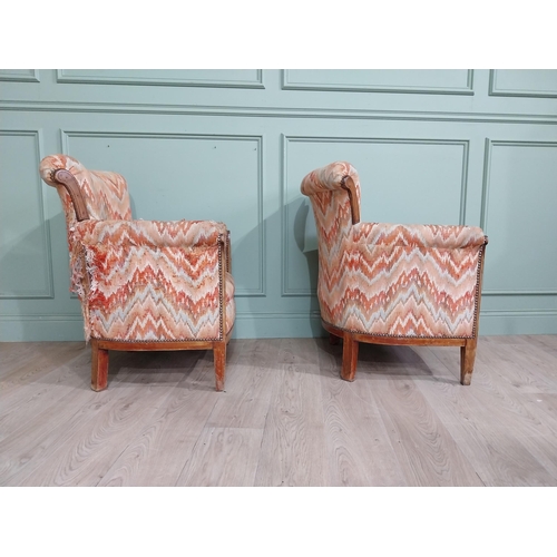 15 - Pair of Edwardian satinwood and upholstered armchairs with stud detail raised on tapered legs. {83 c... 