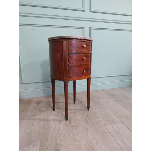 151 - French Edwardian kingwood oval bedside locker with marble top over three short drawers on tapered le... 