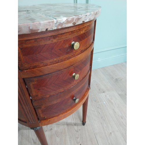 151 - French Edwardian kingwood oval bedside locker with marble top over three short drawers on tapered le... 