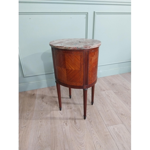 151 - French Edwardian kingwood oval bedside locker with marble top over three short drawers on tapered le... 