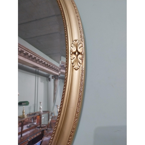 160 - Pair of oval gilt mirrors in the Victorian style with oak leaf decoration. { 86 cm H x 59 cm W}.