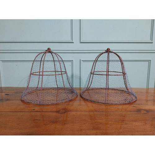 167 - Pair of wrought iron cloches. { 45 cm H x 50 cm Dia.}.