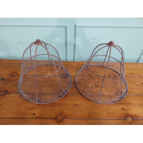 167 - Pair of wrought iron cloches. { 45 cm H x 50 cm Dia.}.