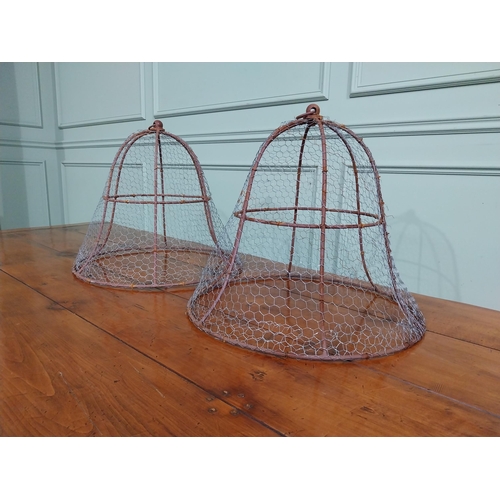 167 - Pair of wrought iron cloches. { 45 cm H x 50 cm Dia.}.