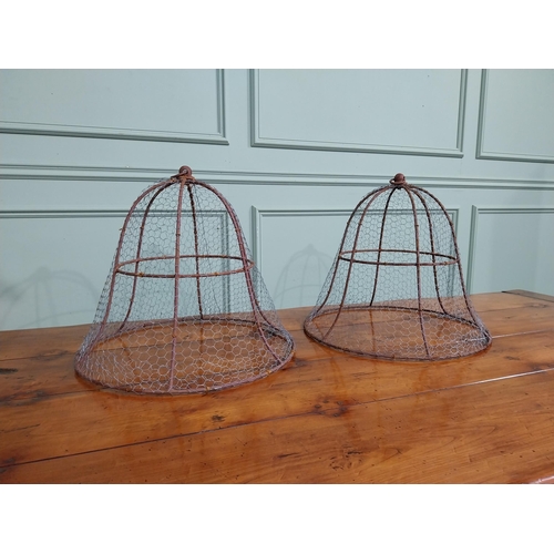 167 - Pair of wrought iron cloches. { 45 cm H x 50 cm Dia.}.