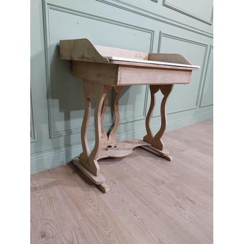 177 - Early 20th C. Pine washstand with gallery back and enamel sink raised on lyre supports and shaped st... 