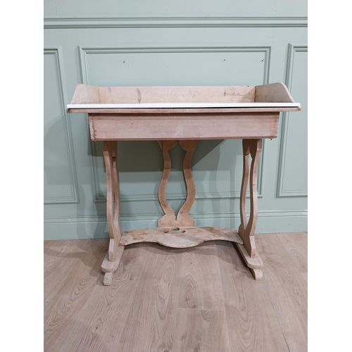 177 - Early 20th C. Pine washstand with gallery back and enamel sink raised on lyre supports and shaped st... 