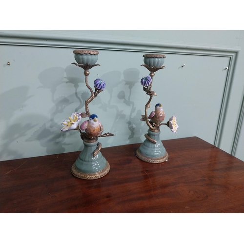 18 - Pair of  ceramic candlesticks decorated with birds and foliage and ormolu mounts. {30 cm H x 15 cm D... 