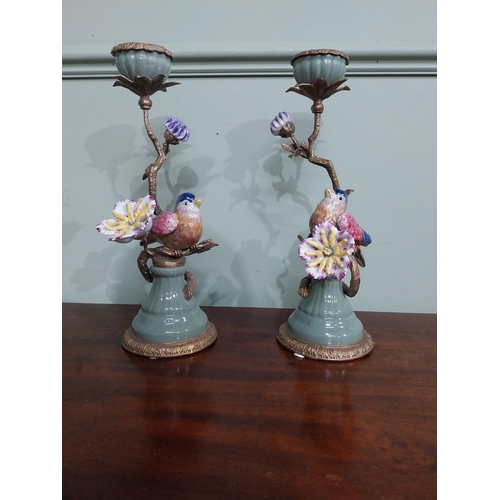 18 - Pair of  ceramic candlesticks decorated with birds and foliage and ormolu mounts. {30 cm H x 15 cm D... 