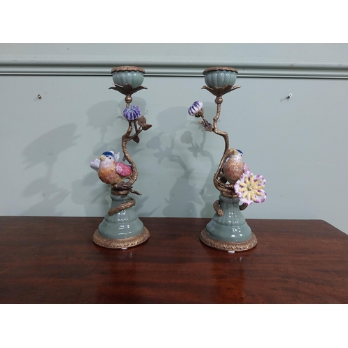 18 - Pair of  ceramic candlesticks decorated with birds and foliage and ormolu mounts. {30 cm H x 15 cm D... 