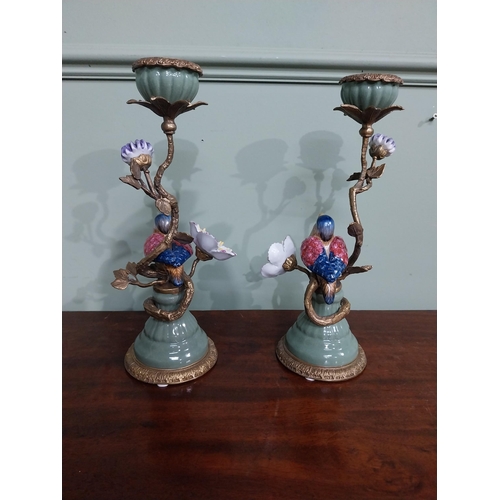 18 - Pair of  ceramic candlesticks decorated with birds and foliage and ormolu mounts. {30 cm H x 15 cm D... 