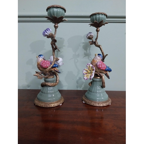 18 - Pair of  ceramic candlesticks decorated with birds and foliage and ormolu mounts. {30 cm H x 15 cm D... 