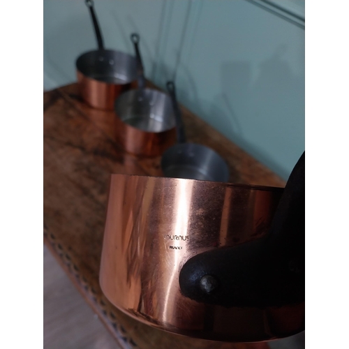 21 - Graduated set of five good quality French copper saucepans with wrought iron handles. {18 cm H x 40 ... 