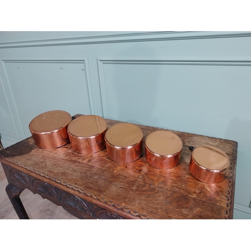 21 - Graduated set of five good quality French copper saucepans with wrought iron handles. {18 cm H x 40 ... 