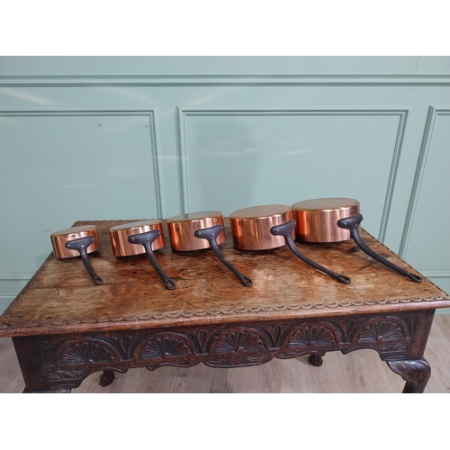 21 - Graduated set of five good quality French copper saucepans with wrought iron handles. {18 cm H x 40 ... 